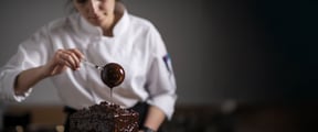 Pastry Chef pouring chocolate